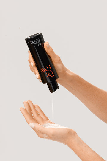 Dr. Few Skincare exfoliating gentle cleanser dispensing in hand