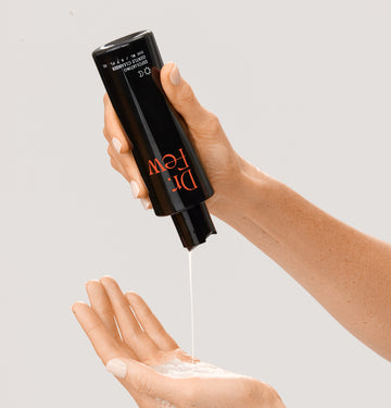 Dr. Few Skincare exfoliating gentle cleanser dispensing in hand