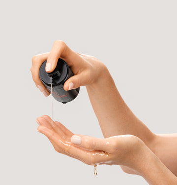 Dr. Few Skincare Supreme Oil Serum dispensing onto hand